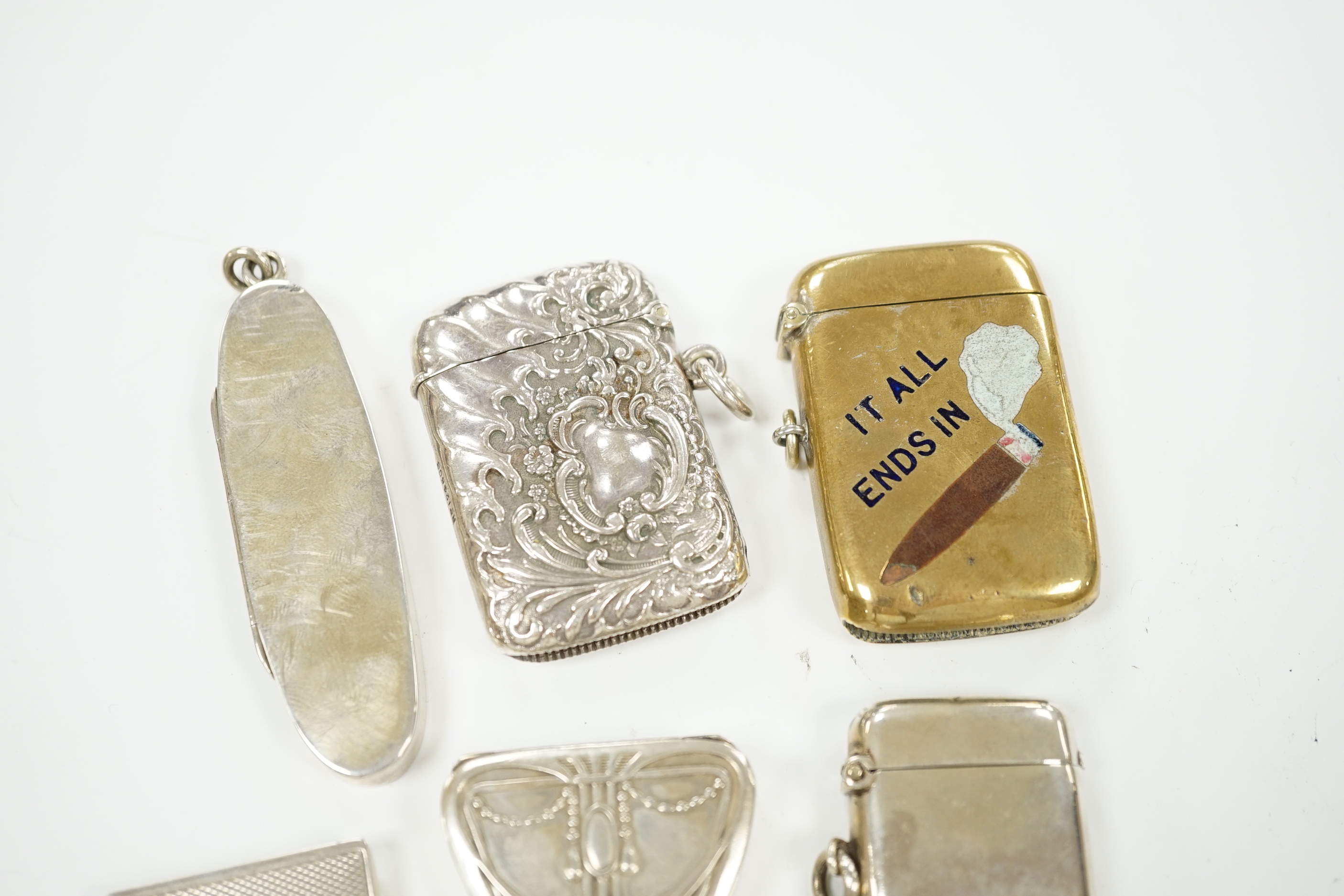 Five assorted silver vesta cases, including Victorian oval by Sampson Mordan, 72mm, a brass and enamel 'It all Ends In' vesta case, two pill boxes and a silver 'envelope' stamp case.